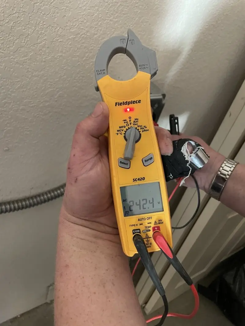 Voltage testing with clamp meter during Circuit Breaker Repair in Hernando